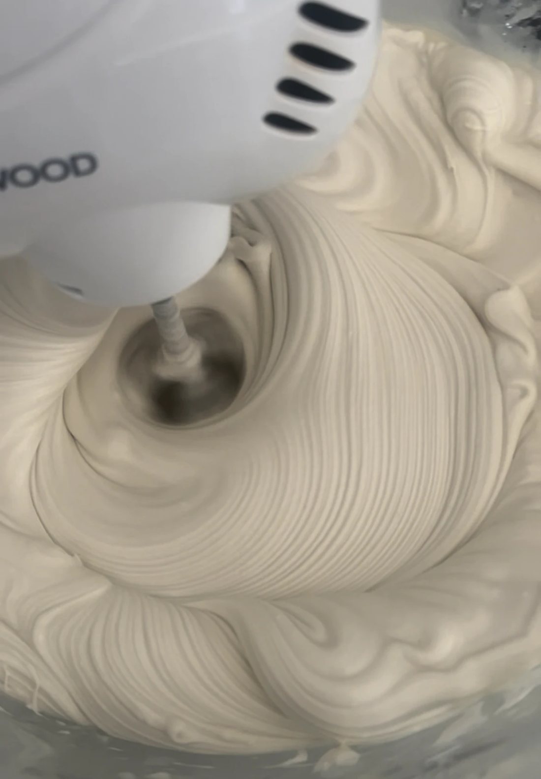 Butter being whipped by hand in the kitchen